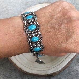 Turquoise and silver tone fashion bracelet. 50